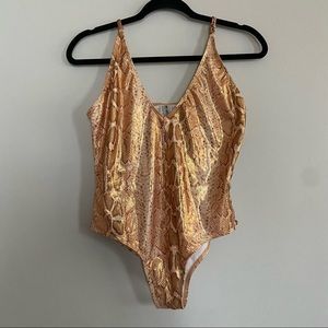 Dippin Daisy’s Metallic Gold Snakeskin One Piece with side cutouts